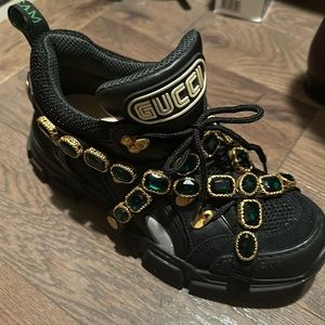 Gucci with green jewels